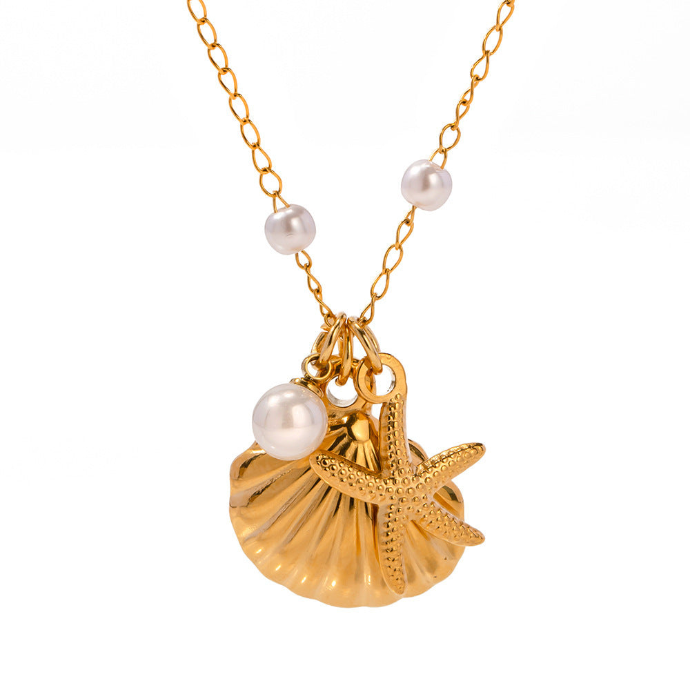 A gold-colored necklace featuring a starfish-shaped pendant with pearl accents and a small pearl chain.