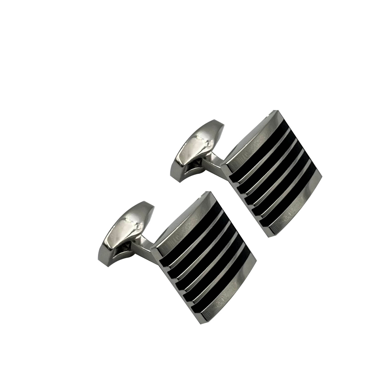 A pair of silver and black enamel cufflinks with a ribbed pattern.